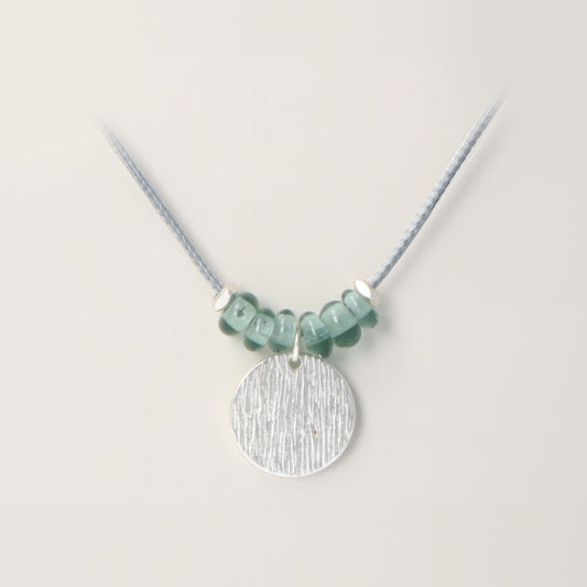 Rancho Necklace Silver Textured Disc Teal Glass Beads on Grey Cord