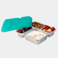 Silver bento box with food compartments and a teal lid on a light gray background