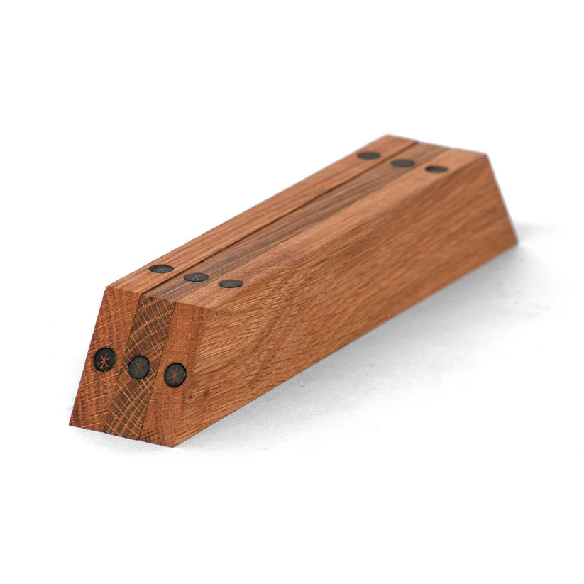 Wooden trivet frame separated and showing magnetic fasesnters on a white background