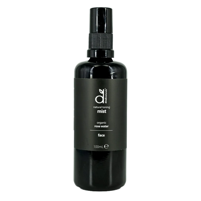 Black bottle of organic rose water mist on a white background