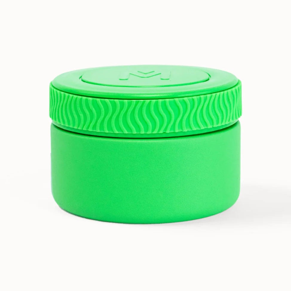 Green container with lid on a white background